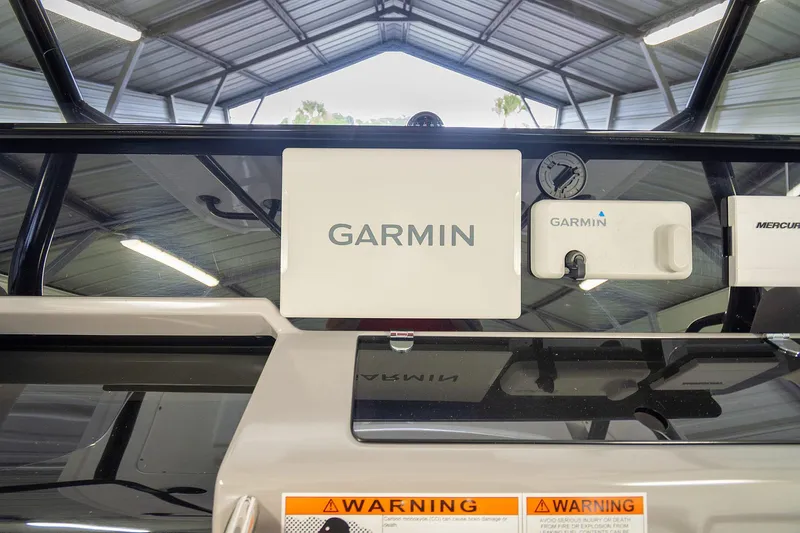  Yacht Photos Pics Garmin equipment on 2020 Jeanneau Leader 9.0 CC boat dashboard in a covered area.