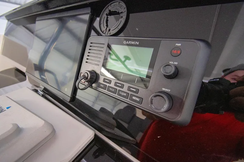  Yacht Photos Pics Control panel of 2020 Jeanneau Leader 9.0 CC with Garmin navigation system.
