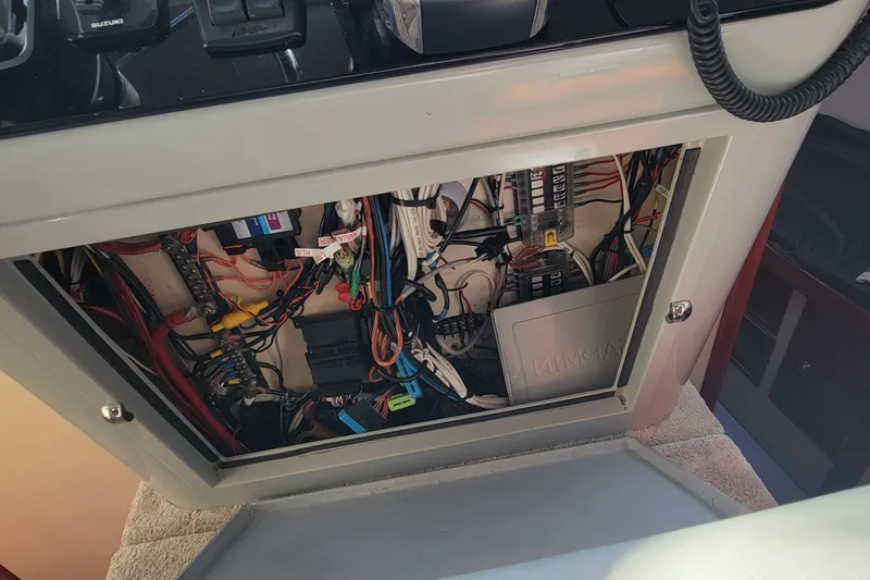  Yacht Photos Pics Electrical panel of a 2001 Zeta 32 Power Cat, showcasing wiring and components.