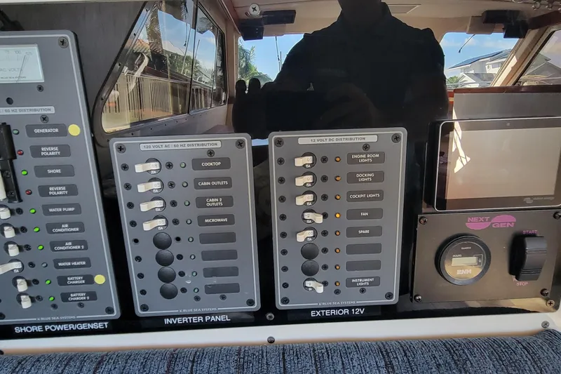  Yacht Photos Pics Control panel of a 2001 Zeta 32 Power Cat boat, featuring various switches and gauges.