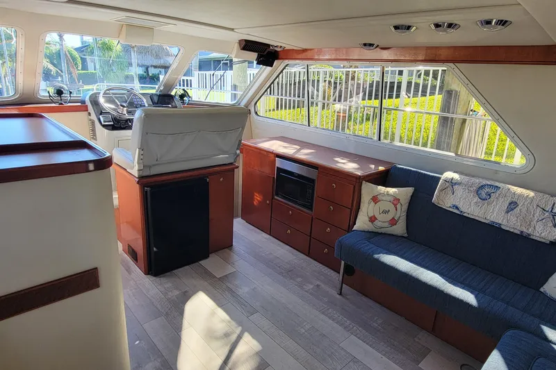  Yacht Photos Pics Interior of 2001 Zeta 32 Power Cat with seating, helm, and windows.