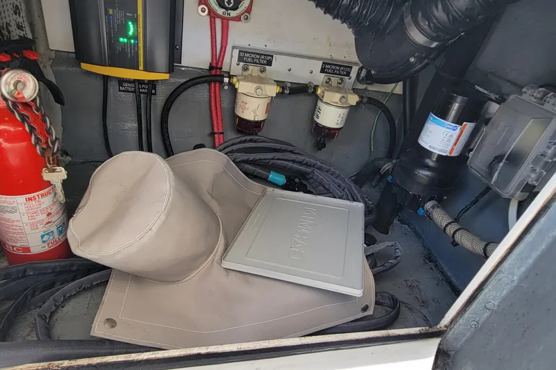  Yacht Photos Pics Engine compartment of a 2001 Zeta 32 Power Cat with fire extinguisher and fuel filters.