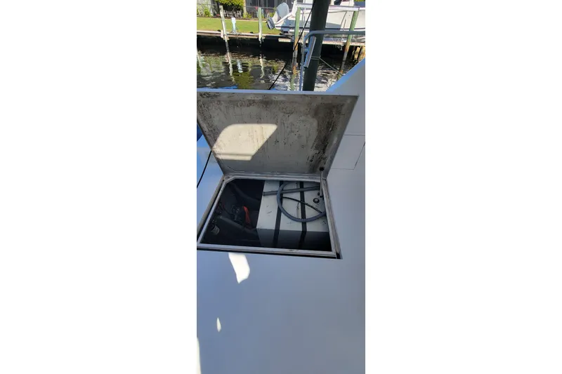  Yacht Photos Pics Open hatch on 2001 Zeta 32 Power Cat, revealing internal compartment.