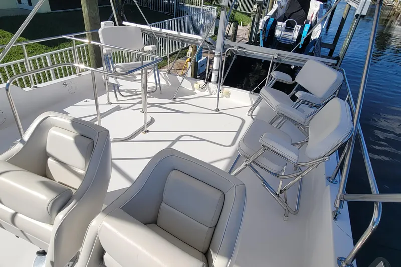  Yacht Photos Pics Spacious deck of 2001 Zeta 32 Power Cat with comfortable seating and table.