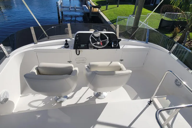  Yacht Photos Pics 2001 Zeta 32 Power Cat boat helm with dual seats and steering wheel.