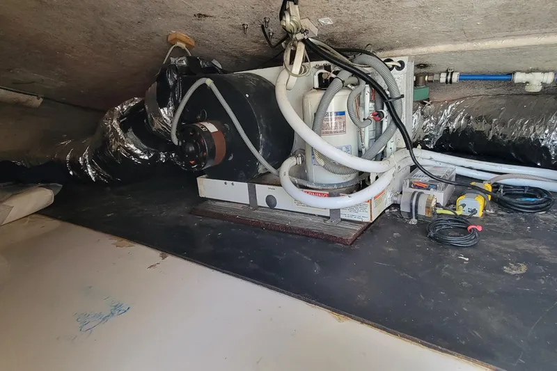  Yacht Photos Pics Engine compartment of a 2001 Zeta 32 Power Cat with visible machinery and wiring.