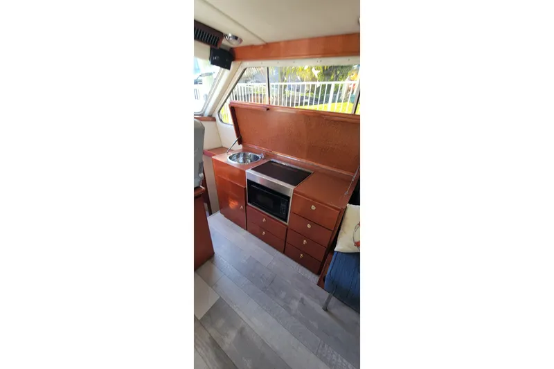  Yacht Photos Pics Interior of 2001 Zeta 32 Power Cat with kitchenette and modern amenities.