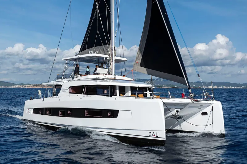 Lumiere Yacht Photos Pics 2026 Bali 5.2 catamaran sailing on open sea under clear skies.