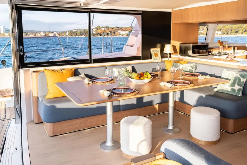 Lumiere Yacht Photos Pics Luxurious interior of 2026 Bali 5.2 yacht with elegant dining area and scenic ocean view.