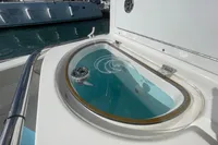 Livewell on 2022 Aquila Molokai 28 boat, featuring sleek design and stainless steel railing.