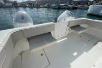 Aquila Molokai 28 (2022) boat interior with seating and twin outboard motors.