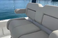 Luxury seating on 2022 Aquila Molokai 28 boat with ocean backdrop.