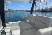 2022 Aquila Molokai 28 boat interior with marina view and sailboats.
