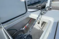 Anchor chain compartment on 2022 Aquila Molokai 28 boat at dock.