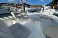 Aquila Molokai 28, 2022 model, featuring a sleek deck with seating and table.