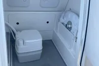 2022 Aquila Molokai 28 boat interior with compact marine toilet.