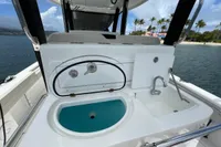 Aquila Molokai 28 (2022) boat sink and faucet setup with ocean view.