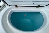Livewell tank on 2022 Aquila Molokai 28 boat, filled with water.