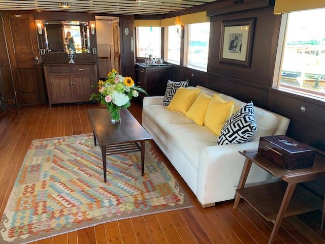 Luxurious 1947 Trumpy Raised Pilot House interior with elegant decor and wooden flooring.