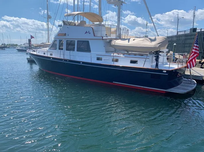 Southerly Yacht Photos Pics Lyman-Morse 52 yacht from 1990 docked in a sunny marina.