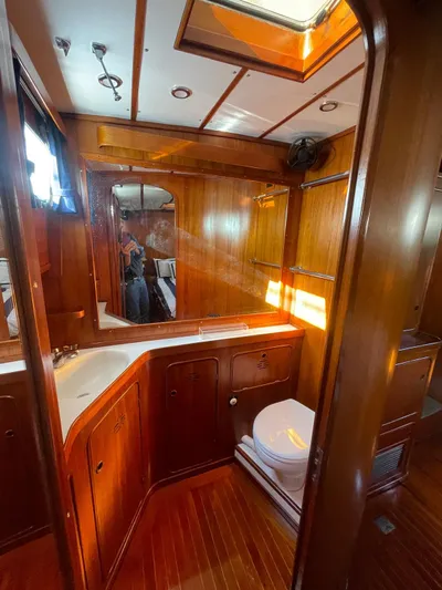 Southerly Yacht Photos Pics Luxurious wooden interior of 1990 Lyman-Morse 52 yacht bathroom with skylight.