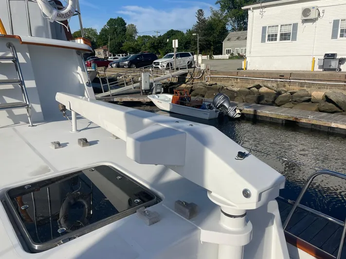 Southerly Yacht Photos Pics Lyman-Morse 52 yacht deck with davit arm, docked at marina, 1990 model.