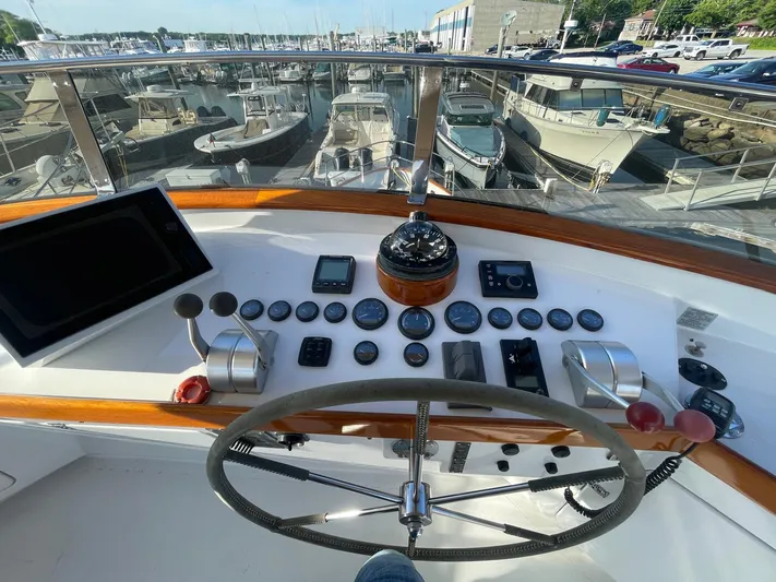 Southerly Yacht Photos Pics Cockpit view of a 1990 Lyman-Morse 52 yacht with navigation instruments and steering wheel.