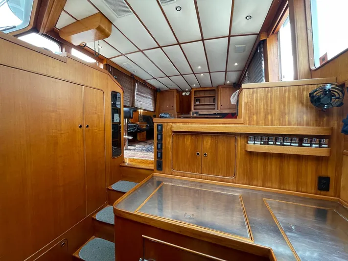 Southerly Yacht Photos Pics Interior of 1990 Lyman-Morse 52 yacht with wooden cabinetry and stainless steel surfaces.