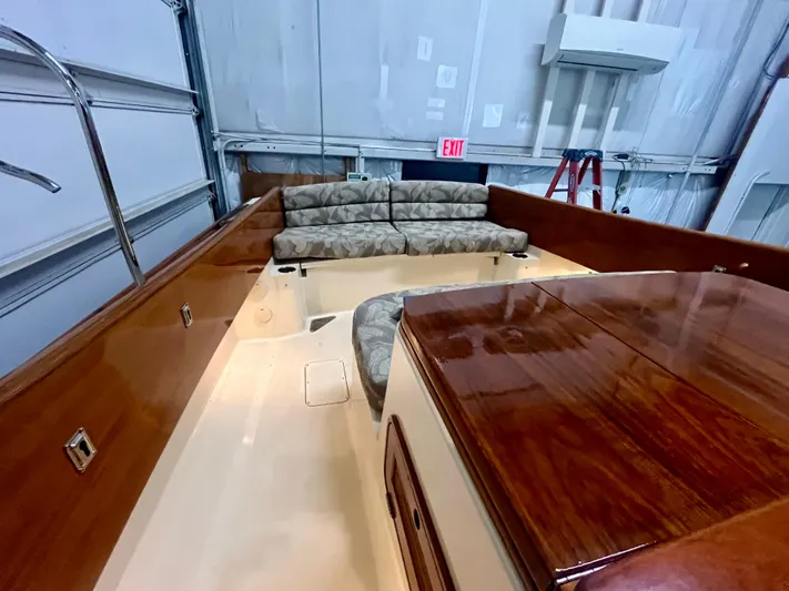  Yacht Photos Pics 2005 Hinckley Picnic Boat EP interior with wooden finish and cushioned seating.