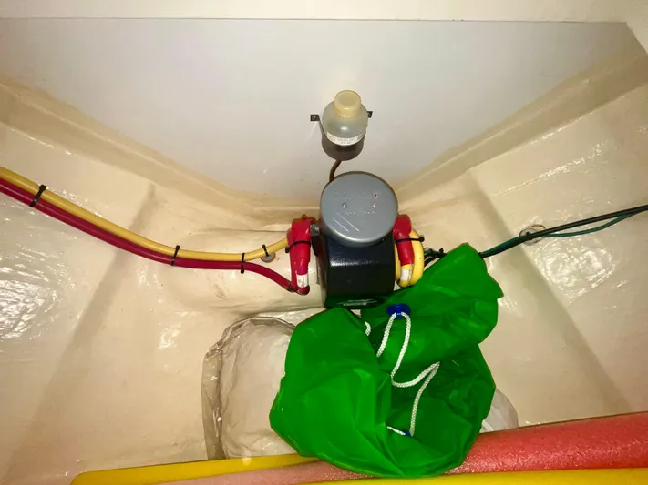  Yacht Photos Pics 2005 Hinckley Picnic Boat EP interior wiring and equipment with colorful cables and green bag.