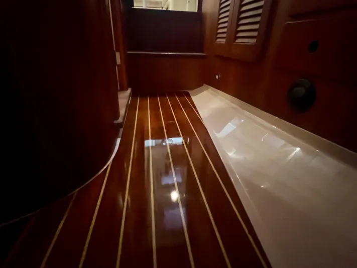  Yacht Photos Pics 2005 Hinckley Picnic Boat EP interior with polished wooden flooring and elegant design.
