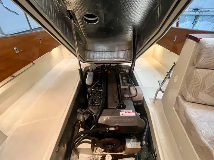  Yacht Photos Pics Engine compartment of a 2005 Hinckley Picnic Boat EP, showcasing interior details and design.