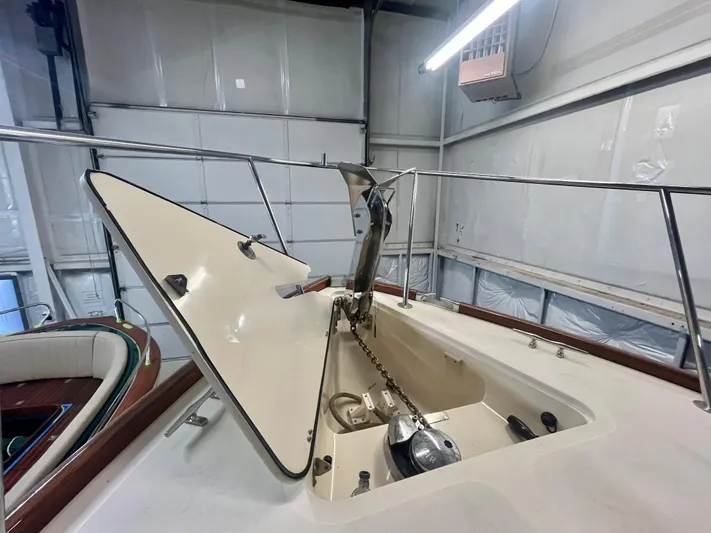  Yacht Photos Pics 2005 Hinckley Picnic Boat EP anchor compartment in a garage setting.