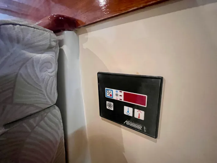  Yacht Photos Pics Control panel on 2005 Hinckley Picnic Boat EP interior, near patterned upholstery.