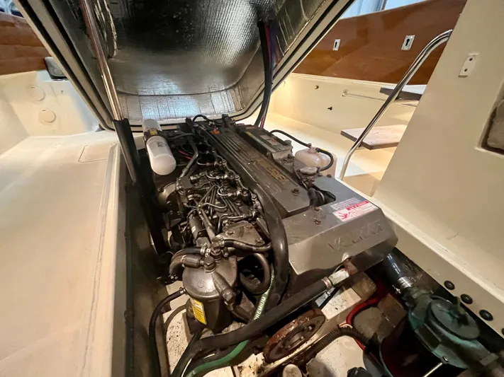  Yacht Photos Pics Engine compartment of a 2005 Hinckley Picnic Boat EP, showcasing detailed mechanical components.