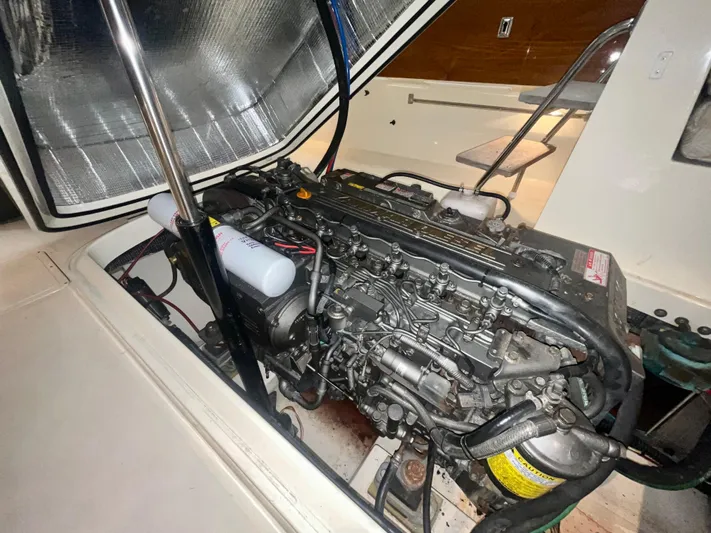  Yacht Photos Pics Engine compartment of a 2005 Hinckley Picnic Boat EP, showcasing detailed mechanical components.