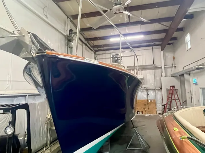  Yacht Photos Pics 2005 Hinckley Picnic Boat EP in storage, showcasing sleek design and craftsmanship.