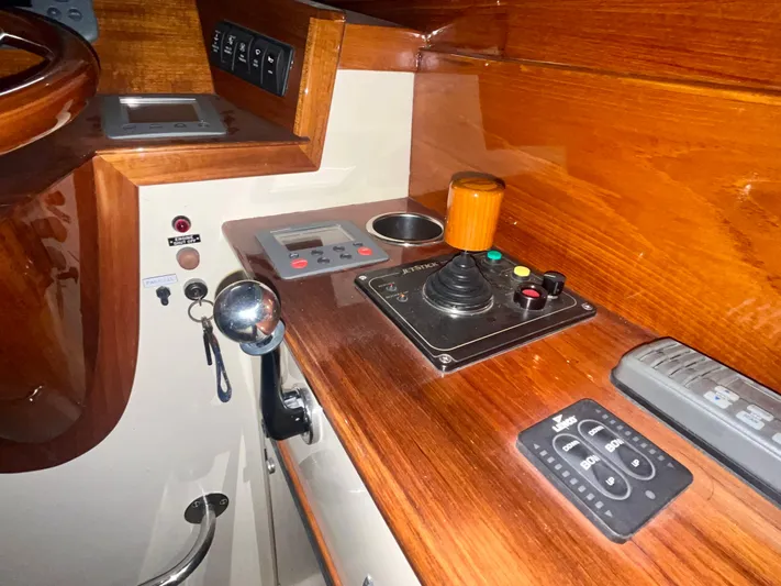  Yacht Photos Pics 2005 Hinckley Picnic Boat EP helm with wooden dashboard and control panel.