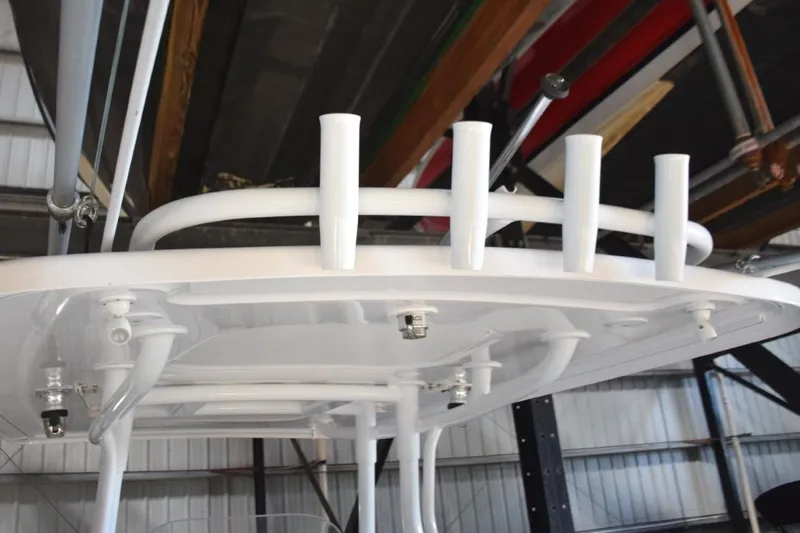 Oz Yacht Photos Pics Fishing rod storage on aft hardtop, crank adjustable anchor/steaming light, LED spreader lights, white powder coated metal supports and rails.