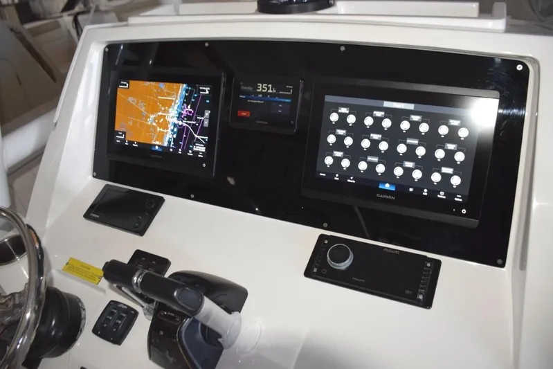 Oz Yacht Photos Pics Dual Garmin 12-inch displays with Garmin autopilot between. Digital switching for boat systems via Garmin.