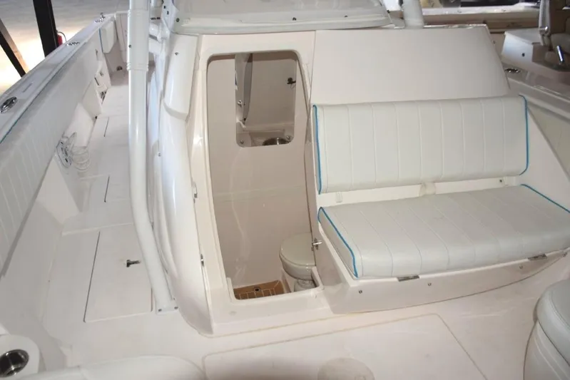 Oz Yacht Photos Pics Console electrically slides open to head compartment.