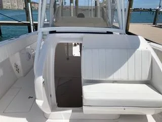  Yacht Photos Pics 2019 Intrepid 400 Center Console boat interior with white seating and open cabin door.
