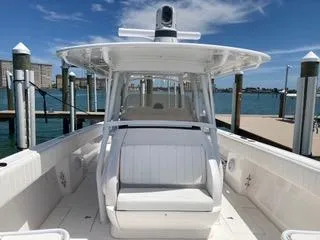  Yacht Photos Pics 2019 Intrepid 400 Center Console boat docked, featuring sleek design and spacious seating.