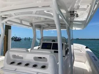  Yacht Photos Pics 2019 Intrepid 400 Center Console boat with sleek design, docked by the water.