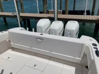  Yacht Photos Pics 2019 Intrepid 400 Center Console boat with triple outboard engines at dock.