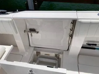  Yacht Photos Pics 2019 Intrepid 400 Center Console boat deck with storage compartment open.