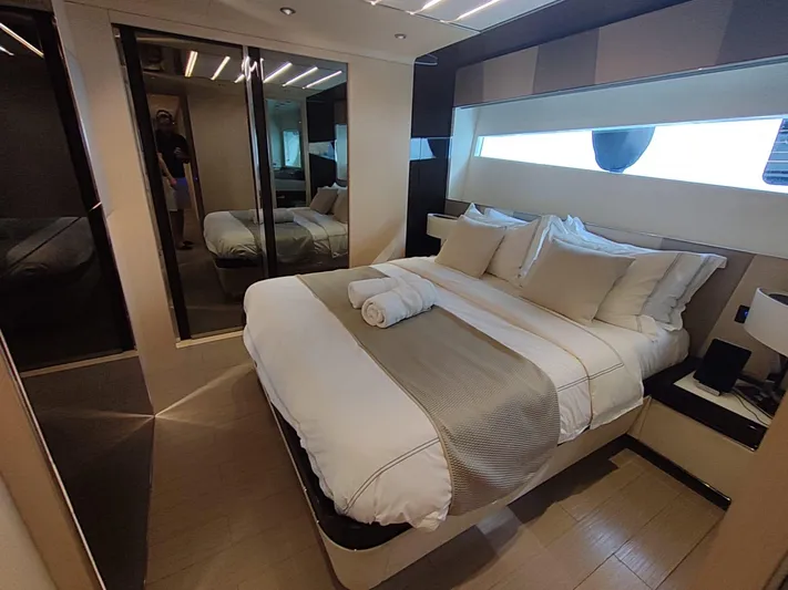  Yacht Photos Pics Luxurious bedroom interior of 2017 Dominator Ilumen 28 yacht with modern design and elegant bedding.