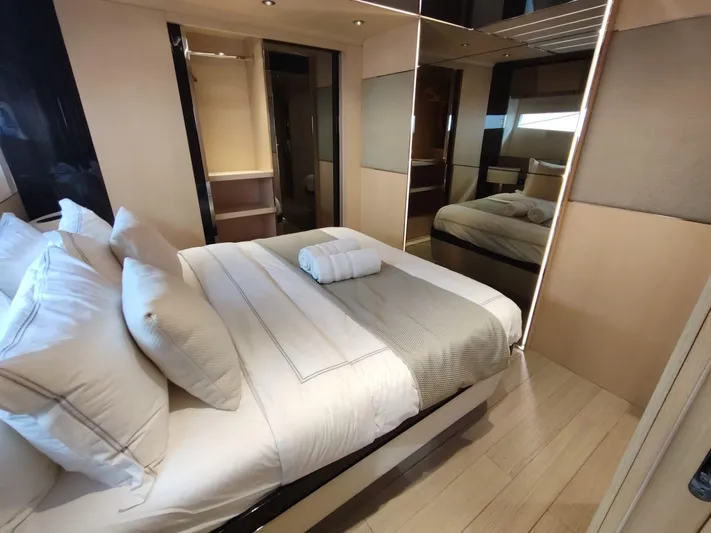  Yacht Photos Pics Luxurious bedroom interior of 2017 Dominator Ilumen 28 yacht with elegant bedding and modern design.