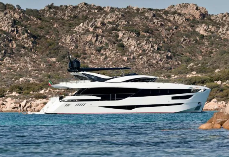  Yacht Photos Pics Luxurious 2017 Dominator Ilumen 28 yacht anchored near rocky coastline.