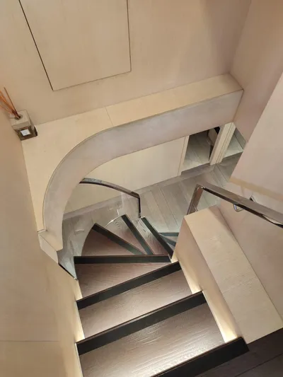  Yacht Photos Pics Staircase inside 2017 Dominator Ilumen 28 yacht, featuring modern design and sleek finishes.